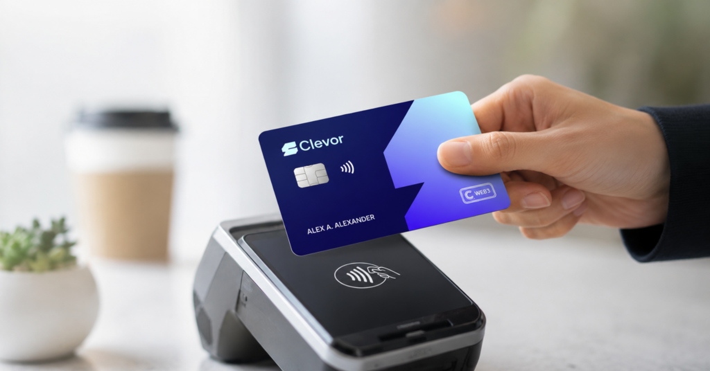 Hand tapping a blue Clevor smart card on a contactless payment terminal to make an EMV crypto debit card payment