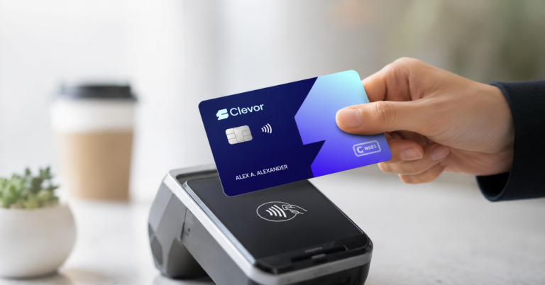 Hand tapping a blue Clevor smart card on a contactless payment terminal to make an EMV crypto debit card payment